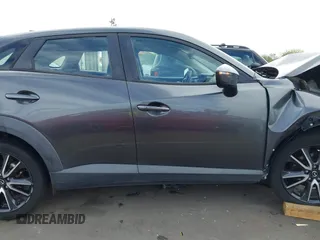 2018 Mazda CX-3 Touring z VIN JM1DKFC7XJ0312349, wystawiony jako IAAI lot #42368311 z przebiegiem 97 772 mil mil oraz . Historia ofert i sprzedaży dostępna na DreamBid. Obrazek 14.