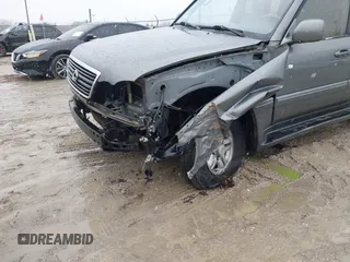 2000 Lexus LX 470 z VIN JT6HT00W8Y0092556, wystawiony jako IAAI lot #41727615 z przebiegiem 156 262 mil mil oraz . Historia ofert i sprzedaży dostępna na DreamBid. Obrazek 6.