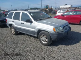 2004 Jeep Grand Cherokee Laredo z VIN 1J4GW48S34C272700, wystawiony jako IAAI lot #42494918 z przebiegiem 214 843 mil mil oraz . Historia ofert i sprzedaży dostępna na DreamBid. Obrazek 1.