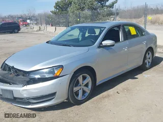 2013 Volkswagen Passat SE w/Sunroof & Nav with VIN 1VWBH7A33DC145554, listed as a IAAI auction lot 41808150 with 142,051 mi miles. Bid and sale history available at carsss.com. Image 2.
