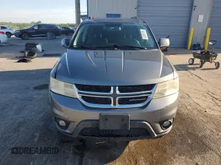 2013 Dodge Journey SXT with VIN 3C4PDCBG0DT522408, listed as a Copart auction lot 62699195 with 130,665 mi miles and Salvage title. Bid and sale history available at DreamBid. Image 5.