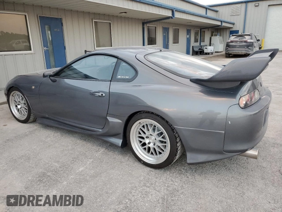 1996 Toyota Supra с VIN JZA800034162, выставлен на аукционе Copart как лот 80046394 с пробегом 86 285 миль миль и Чистый • Clean title. История ставок и продаж доступна на DreamBid. Изображение 2.