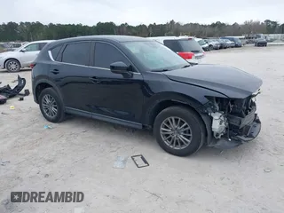 2017 Mazda CX-5 Sport with VIN JM3KFBBL5H0163935, listed as a IAAI auction lot 41186728 with 106,999 mi miles. Bid and sale history available at carsss.com. Image 1.