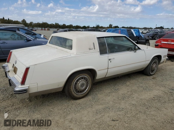 1984 Cadillac Eldorado z VIN 1G6AL5782EE603047, wystawiony jako Copart lot #76777394 z przebiegiem 33 384 mil mil oraz Czysty tytuł • Clean title. Historia ofert i sprzedaży dostępna na DreamBid. Obrazek 3.