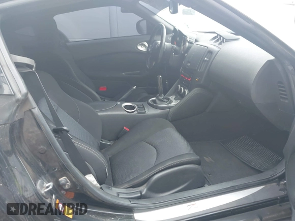 2009 Nissan 370Z Touring with VIN JN1AZ44E69M404341, listed as a IAAI auction lot 41907551 with 144,612 mi miles and . Bid and sale history available at DreamBid. Image 5.