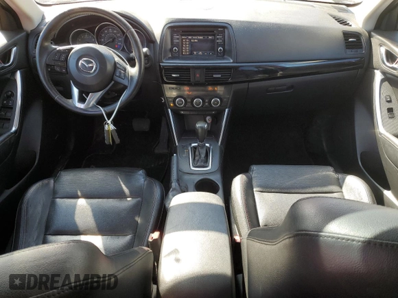 2014 Mazda CX-5 Grand Touring with VIN JM3KE4DY8E0421660, listed as a Copart auction lot 48588525 with 144,939 mi miles and Salvage Title. Bid and sale history available at DreamBid. Image 8.