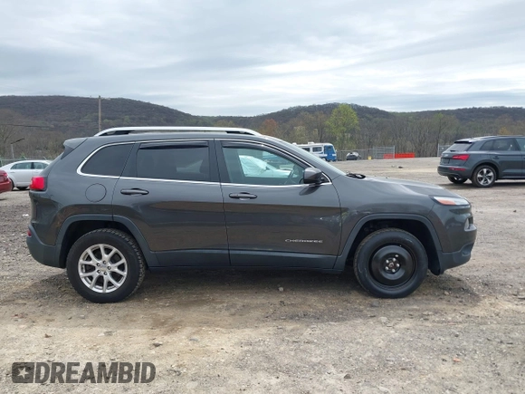 2014 Jeep Cherokee Latitude with VIN 1C4PJMCS5EW201459, listed as a IAAI auction lot 42092653 with 147,430 mi miles. Bid and sale history available at carsss.com. Image 13.