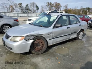 2003 Mazda Protege DX with VIN JM1BJ225131212091, listed as a Copart auction lot 82326154 with 171,184 mi miles and Salvage Title. Bid and sale history available at DreamBid. Image 1.