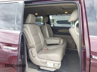 2014 Honda Odyssey Touring with VIN 5FNRL5H9XEB073156, listed as a IAAI auction lot 41990714 with 166,129 mi miles and . Bid and sale history available at DreamBid. Image 8.