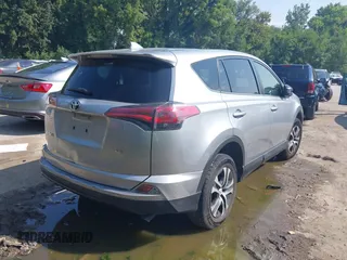 2018 Toyota RAV4 LE with VIN JTMZFREV3JJ161811, listed as a IAAI auction lot 40131640 with 114,330 mi miles. Bid and sale history available at carsss.com. Image 4.