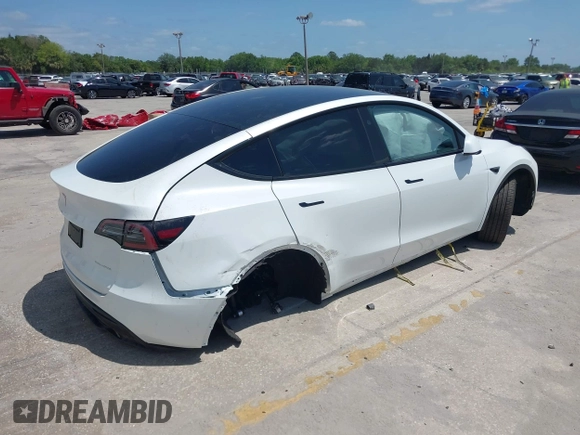 2023 Tesla Model Y Long Range with VIN 7SAYGDEE7PF865539, listed as a IAAI auction lot 42109673 with 34,923 mi miles and . Bid and sale history available at DreamBid. Image 4.
