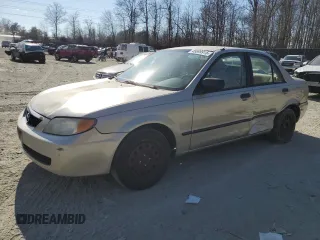 2002 Mazda Protege DX with VIN JM1BJ225520525472, listed as a Copart auction lot 45699915 with 183,457 mi miles and Salvage Title. Bid and sale history available at DreamBid. Image 1.