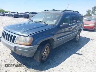 2000 Jeep Grand Cherokee Laredo with VIN 1J4G248S1YC416634, listed as a IAAI auction lot 42036197 with 140,596 mi miles and . Bid and sale history available at DreamBid. Image 2.
