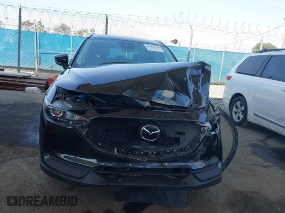2020 Mazda CX-5 Touring with VIN JM3KFACM0L0804998, listed as a IAAI auction lot 41850998 with 44,519 mi miles. Bid and sale history available at carsss.com. Image 12.