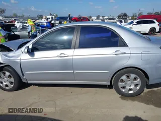 2005 Kia Spectra LX with VIN KNAFE122355139496, listed as a IAAI auction lot 41955660 with 58,676 mi miles. Bid and sale history available at carsss.com. Image 15.