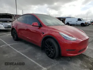 2021 Tesla Model Y Long Range with VIN 5YJYGDEEXMF217816, listed as a Copart auction lot 51008665 with 57,392 mi miles and Salvage Title. Bid and sale history available at DreamBid. Image 4.