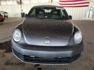 2016 Volkswagen Beetle Denim с VIN 3VW507AT8GM802601, выставлен на аукционе Copart как лот 60335415 с пробегом 71 163 миль миль и Списание • Salvage title. История ставок и продаж доступна на DreamBid. Изображение 5.