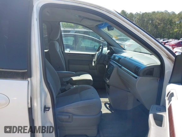 2007 Ford Freestar SEL z VIN 2FMZA52207BA08099, wystawiony jako IAAI lot #42025412 z przebiegiem Nie podano mil oraz . Historia ofert i sprzedaży dostępna na DreamBid. Obrazek 5.