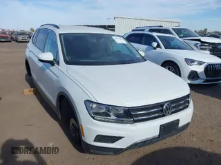 2020 Volkswagen Tiguan SE with VIN 3VV3B7AX0LM039721, listed as a IAAI auction lot 41627081 with 56,405 mi miles and . Bid and sale history available at DreamBid. Image 1.