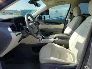 2021 Cadillac XT6 Premium Luxury z VIN 1GYKPCRS5MZ197527, wystawiony jako Copart lot #55952185 z przebiegiem 24 856 mil mil oraz Szkody całkowita. Historia ofert i sprzedaży dostępna na DreamBid. Obrazek 7.