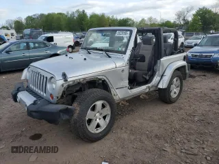 2009 Jeep Wrangler Sahara z VIN 1J4FA54139L710989, wystawiony jako Copart lot #55229195 z przebiegiem 118 586 mil mil oraz Szkoda całkowita • Salvage title. Historia ofert i sprzedaży dostępna na DreamBid. Obrazek 1.