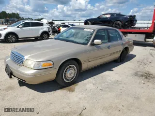 2000 Ford Crown Victoria with VIN 2FAFP73W0YX127395, listed as a Copart auction lot 72442494 with 123,999 mi miles and Salvage Title. Bid and sale history available at carsss.com. Image 1.