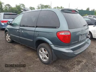 2005 Dodge Caravan SXT with VIN 1D4GP45R55B279825, listed as a IAAI auction lot 42532684 with 157,167 mi miles and . Bid and sale history available at DreamBid. Image 3.