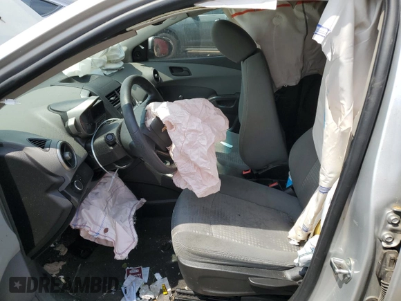 2015 Chevrolet Sonic LS with VIN 1G1JB6SH4F4198631, listed as a Copart auction lot 63808334 with 147,662 mi miles and Salvage title. Bid and sale history available at DreamBid. Image 7.