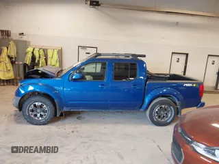 2015 Nissan Frontier SV with VIN 1N6AD0EV4FN709892, listed as a IAAI auction lot 42473594 with 153,103 mi miles and . Bid and sale history available at DreamBid. Image 14.