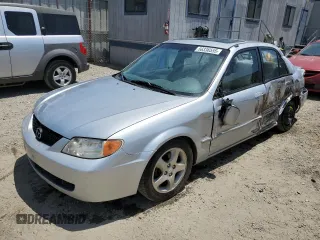 2002 Mazda Protege DX z VIN JM1BJ225920543960, wystawiony jako Copart lot #56336555 z przebiegiem 173 874 mil mil oraz Szkoda całkowita • Salvage title. Historia ofert i sprzedaży dostępna na DreamBid. Obrazek 1.