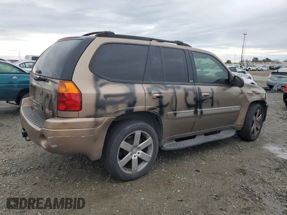 2003 GMC Envoy SLE with VIN 1GKDT13S432263407, listed as a Copart auction lot 44025825 with 154,266 mi miles and Salvage Title. Bid and sale history available at carsss.com. Image 3.