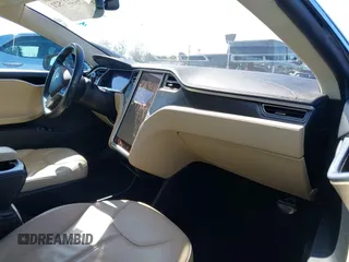 2013 Tesla Model S with VIN 5YJSA1CNXDFP28192, listed as a IAAI auction lot 42227521 with 60,967 mi miles and . Bid and sale history available at DreamBid. Image 5.