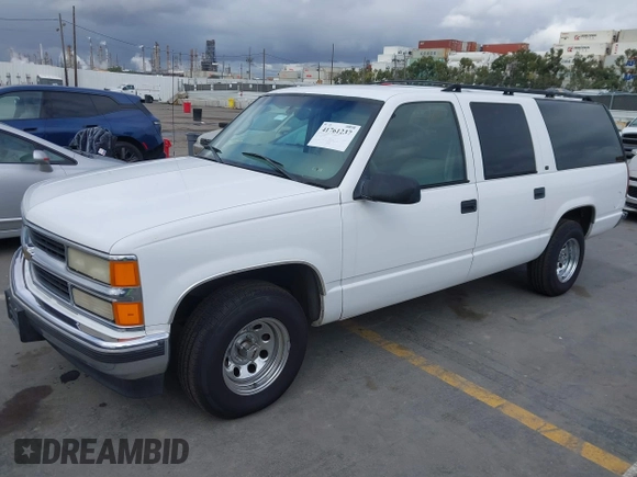 1999 Chevrolet Suburban with VIN 3GNEC16R2XG247140, listed as a IAAI auction lot 41761237 with 202,121 mi miles. Bid and sale history available at carsss.com. Image 2.