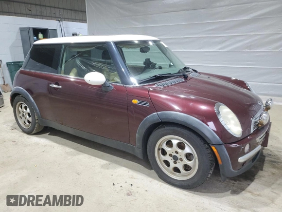 2002 MINI Hardtop with VIN WMWRC33402TC36986, listed as a Copart auction lot 50131045 with 194,224 mi miles and Salvage Title. Bid and sale history available at DreamBid. Image 4.