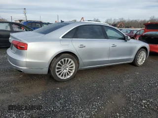 2015 Audi A8 3.0T z VIN WAU3GAFD7FN008548, wystawiony jako Copart lot #50428525 z przebiegiem 128 457 mil mil oraz Czysty tytuł • Clean title. Historia ofert i sprzedaży dostępna na DreamBid. Obrazek 3.