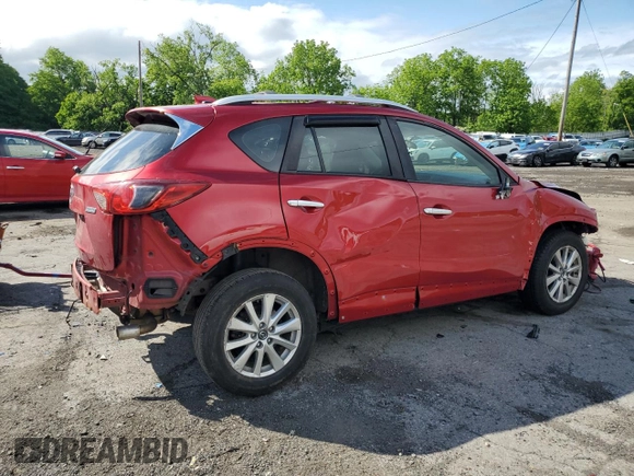 2015 Mazda CX-5 Sport with VIN JM3KE4BY9F0479748, listed as a Copart auction lot 58847805 with 122,698 mi miles and Salvage title. Bid and sale history available at DreamBid. Image 3.