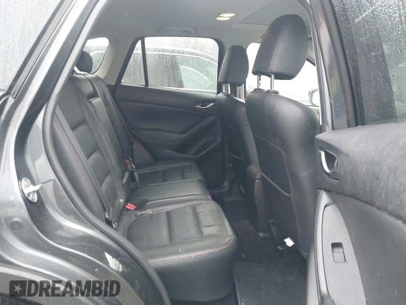 2014 Mazda CX-5 Grand Touring with VIN JM3KE4DY0E0392476, listed as a IAAI auction lot 41419144 with 89,245 mi miles and . Bid and sale history available at carsss.com. Image 8.