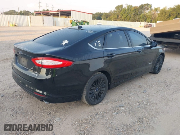 2015 Ford Fusion SE Hybrid with VIN 3FA6P0LU8FR310626, listed as a IAAI auction lot 40048581 with 124,086 mi miles and . Bid and sale history available at DreamBid. Image 4.