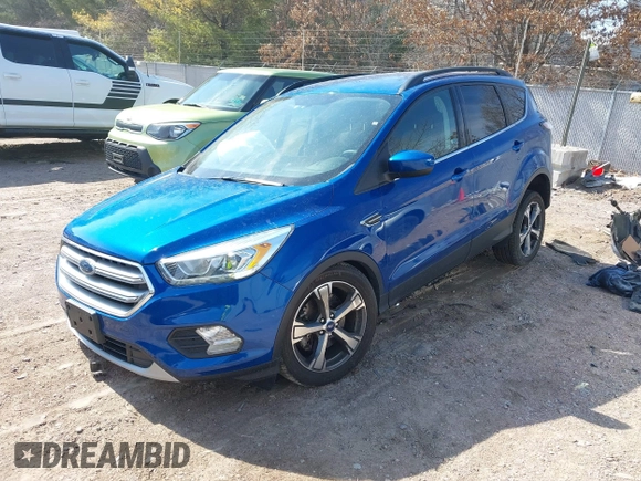 2017 Ford Escape SE z VIN 1FMCU0G95HUB75348, wystawiony jako IAAI lot #41790288 z przebiegiem 55 129 mil mil oraz . Historia ofert i sprzedaży dostępna na DreamBid. Obrazek 17.