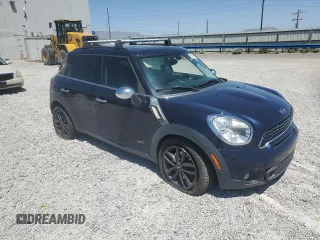 2013 MINI Countryman S ALL4 with VIN WMWZC5C50DWM15256, listed as a Copart auction lot 58080895 with 123,514 mi miles and Salvage title. Bid and sale history available at DreamBid. Image 4.