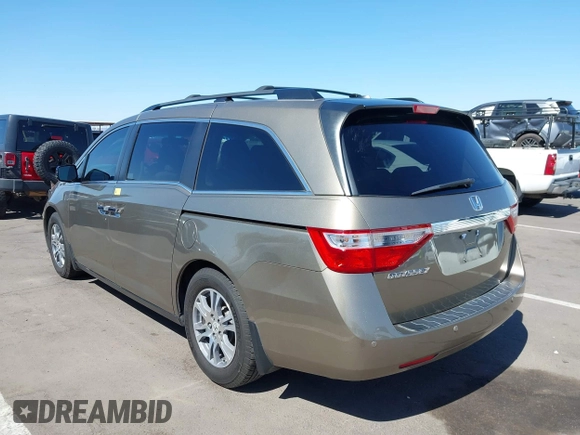 2012 Honda Odyssey EX-L z VIN 5FNRL5H63CB033049, wystawiony jako IAAI lot #42260501 z przebiegiem 165 693 mil mil oraz . Historia ofert i sprzedaży dostępna na DreamBid. Obrazek 3.