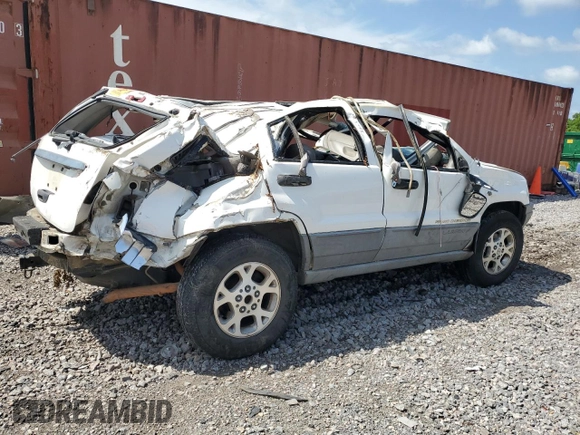 2000 Jeep Grand Cherokee Laredo с VIN 1J4G248S1YC329509, выставлен на аукционе Copart как лот 58589373 с пробегом Не указан миль и Списание • Salvage title. История ставок и продаж доступна на DreamBid. Изображение 3.