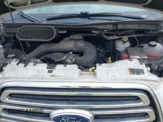 2015 Ford Transit Cargo with VIN 1FTNR1ZM6FKA34609, listed as a IAAI auction lot 42635875 with 214,750 mi miles and . Bid and sale history available at DreamBid. Image 10.