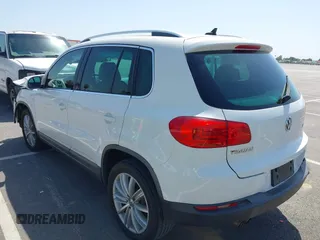 2014 Volkswagen Tiguan SEL with VIN WVGAV3AX9EW512956, listed as a IAAI auction lot 42110002 with 136,034 mi miles and . Bid and sale history available at DreamBid. Image 3.