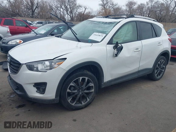 2016 Mazda CX-5 Grand Touring z VIN JM3KE2DY8G0885006, wystawiony jako IAAI lot #41615873 z przebiegiem 118 890 mil mil oraz . Historia ofert i sprzedaży dostępna na DreamBid. Obrazek 17.