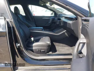 2022 Tesla Model S Plaid with VIN 5YJSA1E61NF483354, listed as a IAAI auction lot 41973636 with 32,541 mi miles and . Bid and sale history available at DreamBid. Image 5.