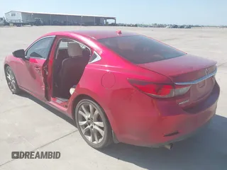 2014 Mazda 6 i Grand Touring with VIN JM1GJ1W65E1141953, listed as a IAAI auction lot 42027145 with 187,514 mi miles and . Bid and sale history available at DreamBid. Image 3.