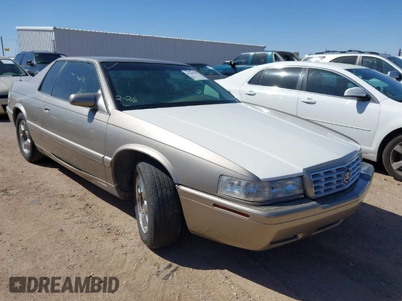 2001 Cadillac Eldorado Touring ETC z VIN 1G6ET12971B109319, wystawiony jako IAAI lot #41682779 z przebiegiem 147 515 mil mil oraz . Historia ofert i sprzedaży dostępna na DreamBid. Obrazek 1.