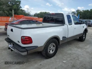 2003 Ford F-150 XL with VIN 1FTRX07W13KC28871, listed as a Copart auction lot 59003245 with 180,197 mi miles and Salvage title. Bid and sale history available at DreamBid. Image 3.