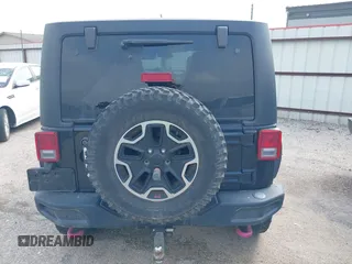 2015 Jeep Wrangler Unlimited Rubicon z VIN 1C4BJWFG2FL572417, wystawiony jako IAAI lot #41895927 z przebiegiem 54 981 mil mil oraz . Historia ofert i sprzedaży dostępna na DreamBid. Obrazek 16.